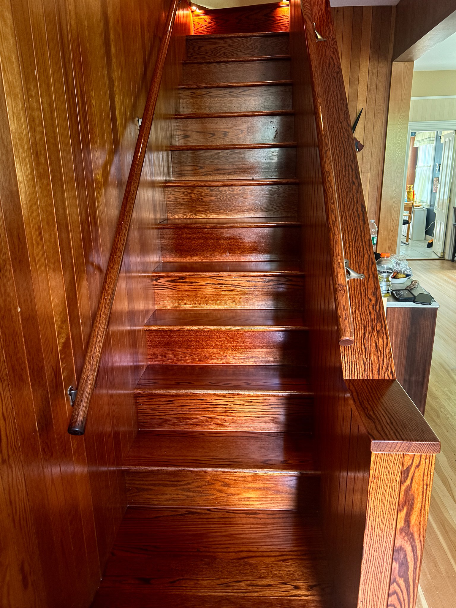 A room with finished wooden floors and trim